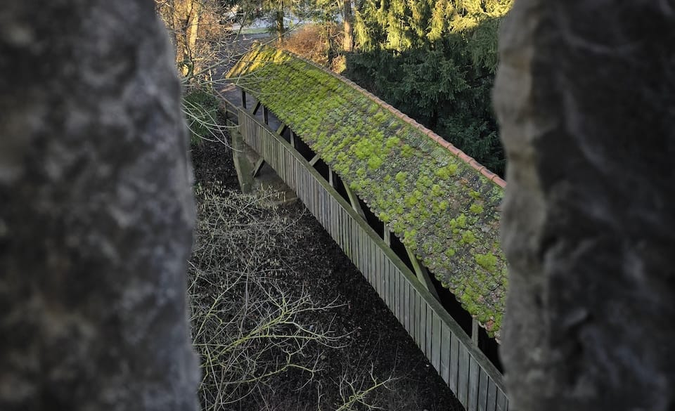 A bridge in front of the historic city wall around Rothenburg ob der Tauber.